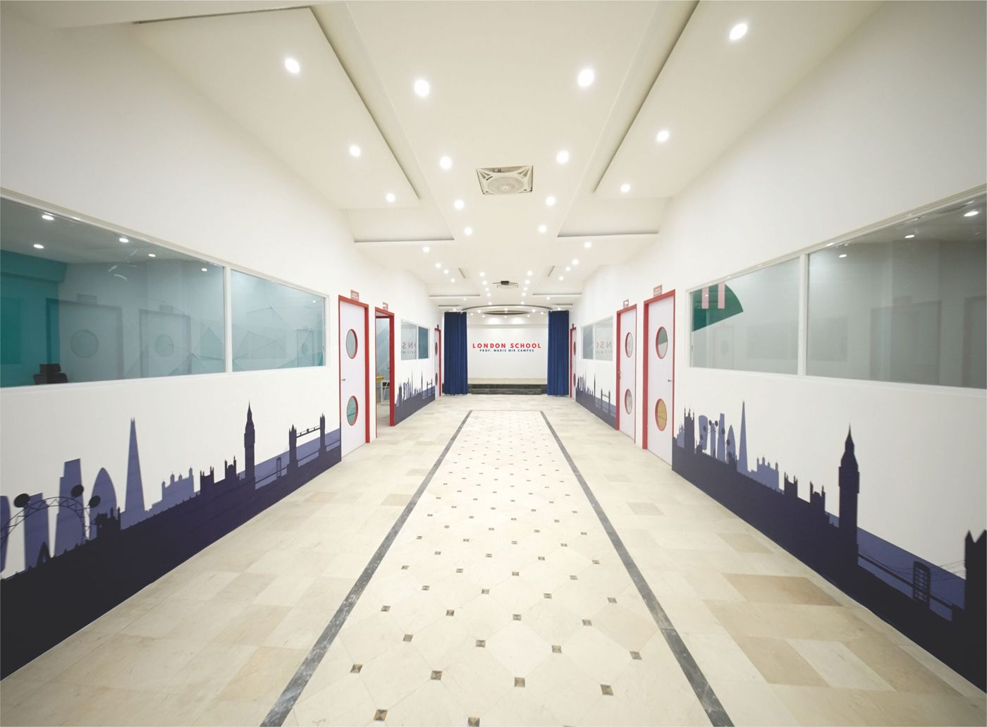 The London School hallway with London skyline mural and Prof. Waris Mir Campus branding