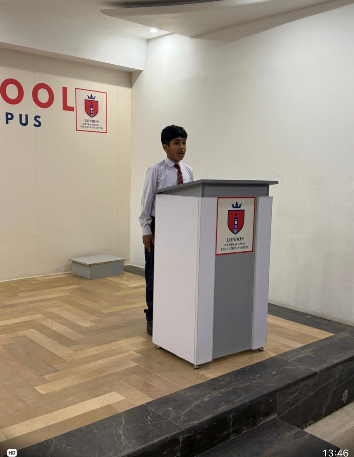 Student giving a speech at the school podium