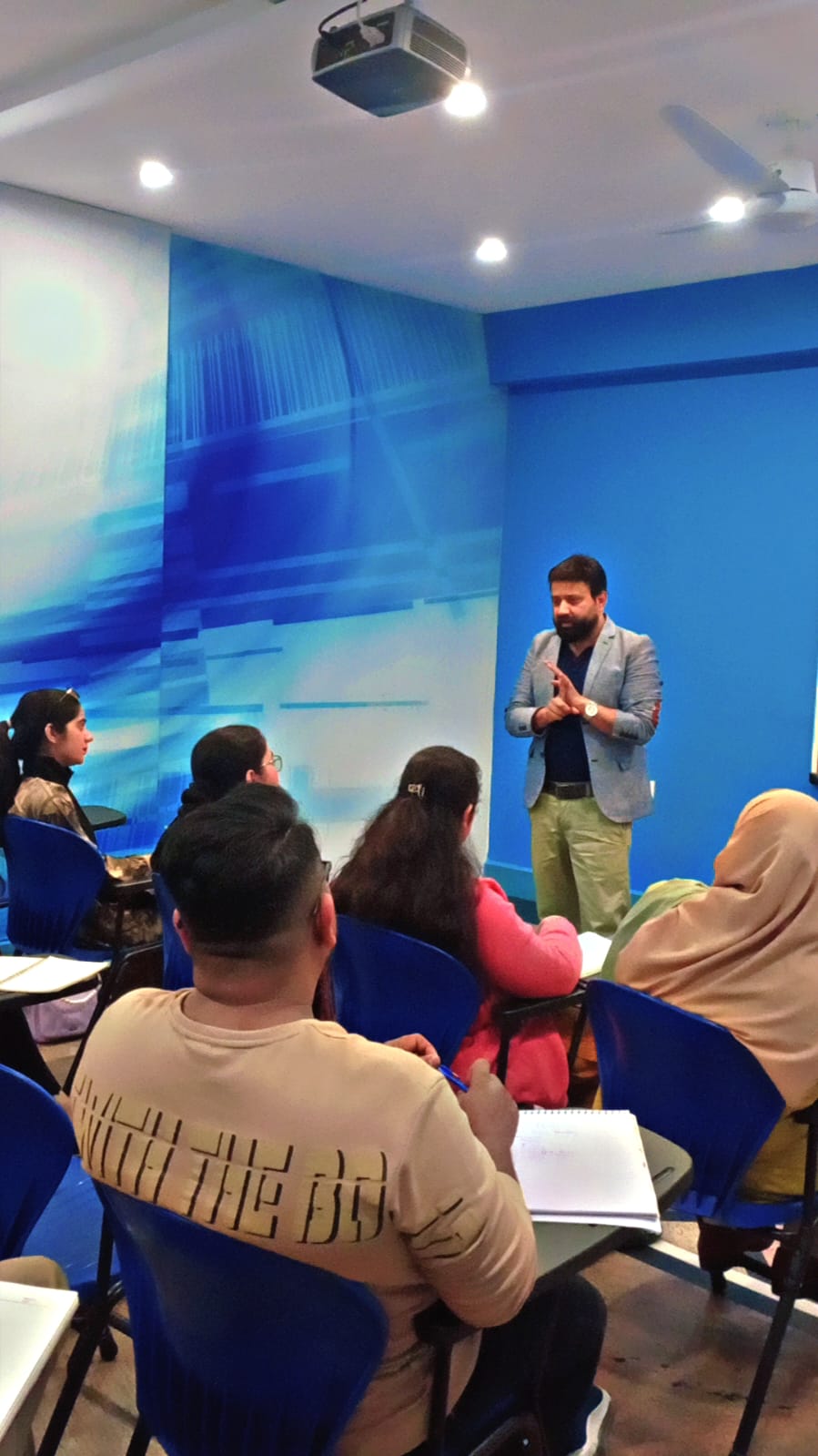 Teacher being trained by presenter